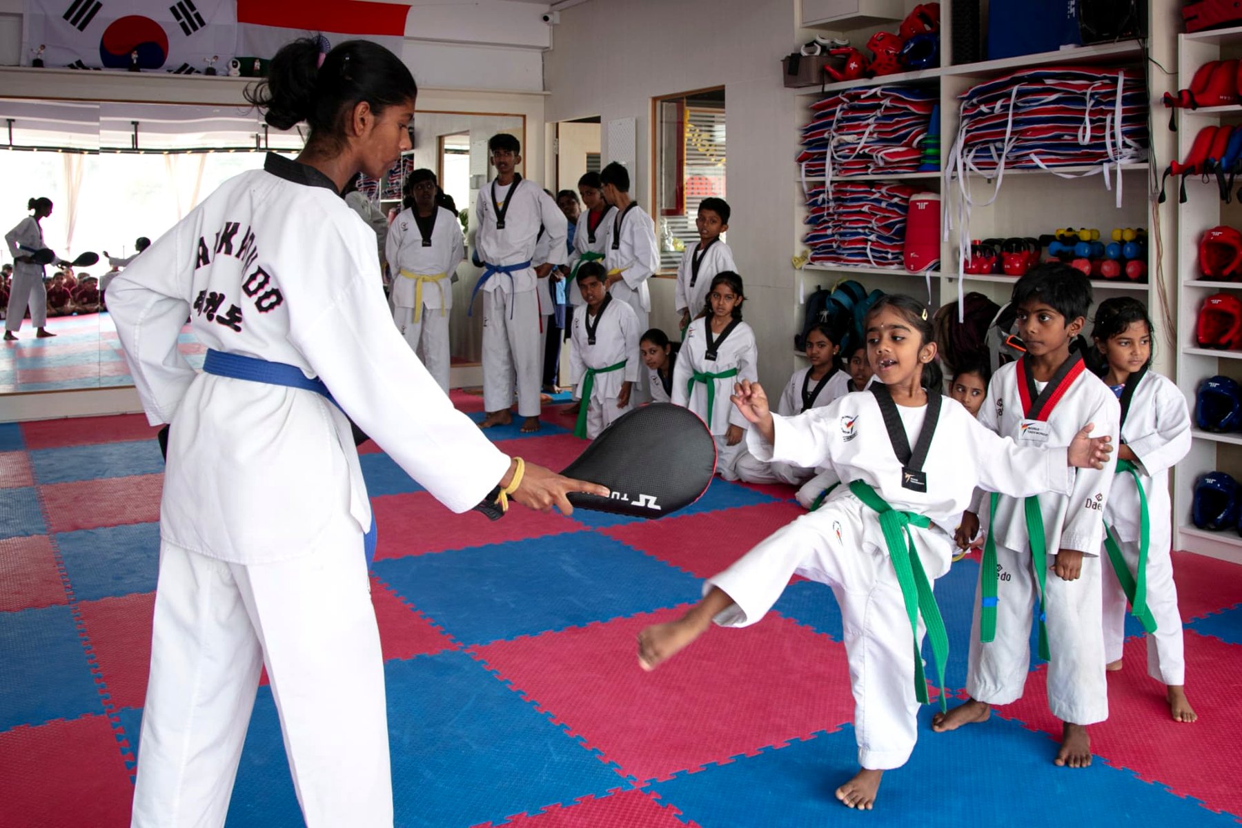 Little Tigers practising kicks on the paddle during training