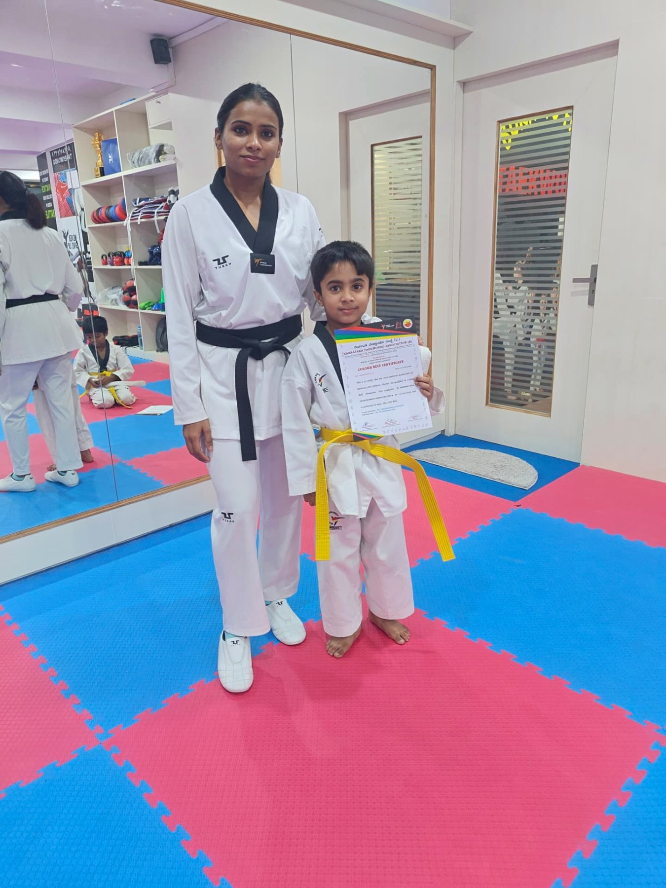 Yellow belt promotion — Little Tigers grading certificate presentation