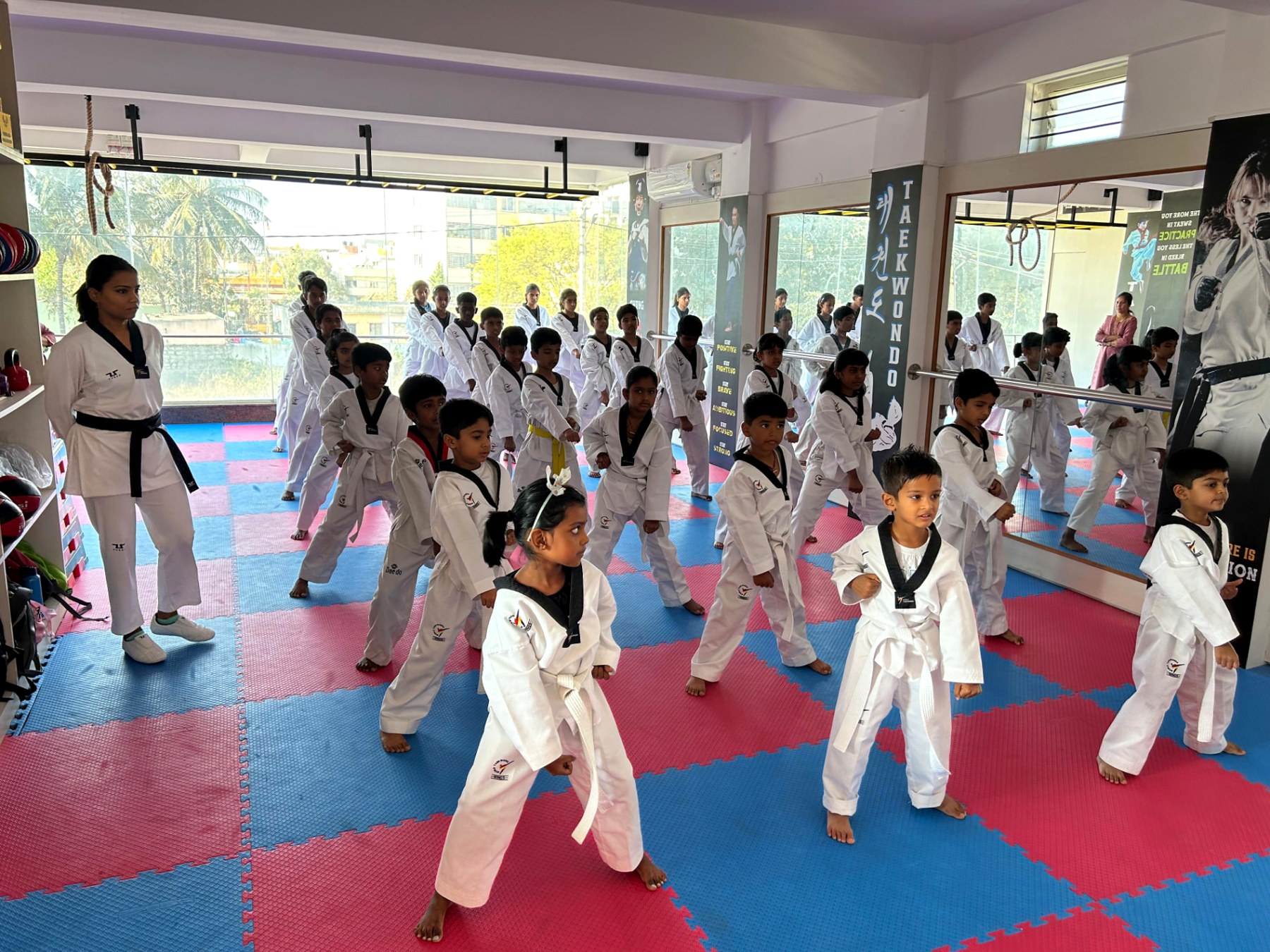 Little Tigers and juniors drilling stances together in the morning batch