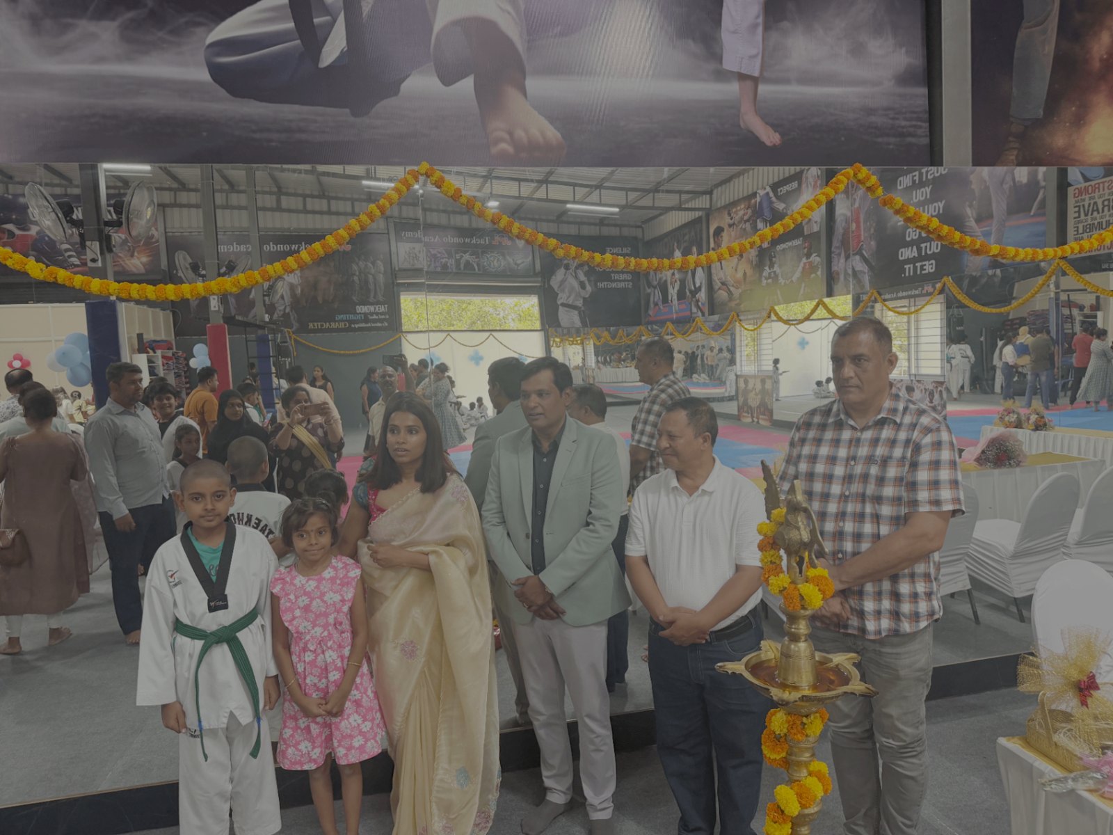 Students and chief guests at the ceremonial lamp inside the new hall